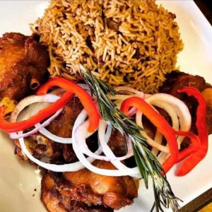 Rice and red beans, with fried turkey served with salad.