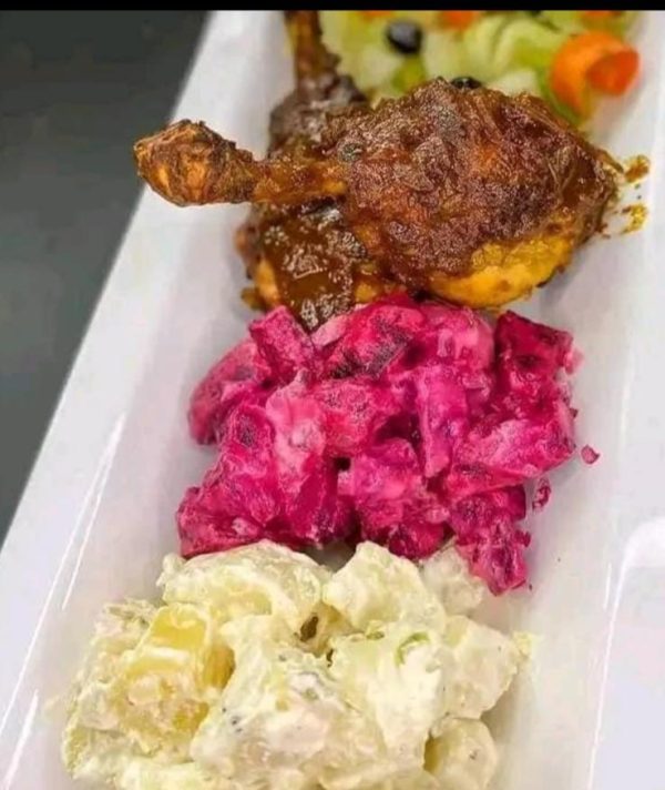 Chicken, boiled or fried plantain served with potatoes salad and beat salad ( pomme de terre , bettrave)